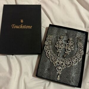 Silver earrings and necklace set still in packaging